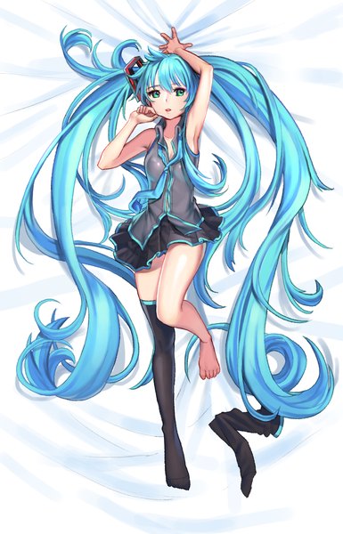 Anime picture 900x1400 with vocaloid hatsune miku hyoin doyoom single tall image looking at viewer blush fringe open mouth twintails green eyes bent knee (knees) lying very long hair barefoot from above aqua hair no shoes zettai ryouiki