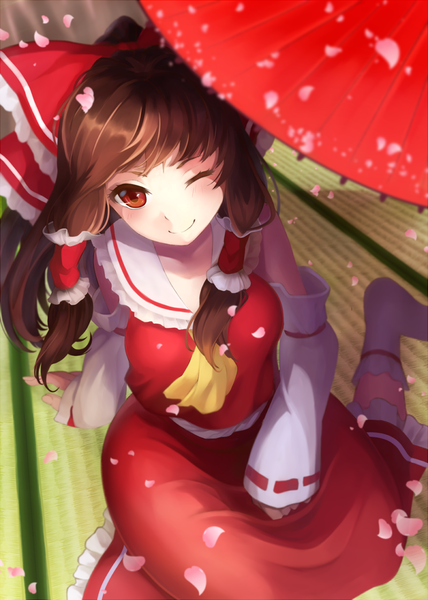 Anime picture 800x1120 with touhou hakurei reimu nemunemu (bluelight5) single long hair tall image looking at viewer blush smile red eyes brown hair traditional clothes one eye closed wink miko girl skirt bow hair bow petals