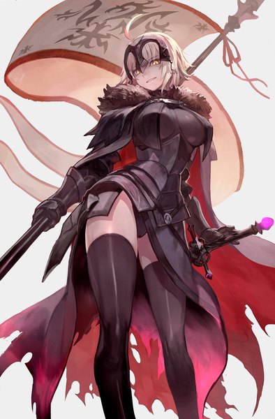 Anime picture 986x1500 with fate (series) fate/grand order fate/apocrypha jeanne d'arc (fate) (all) jeanne d'arc alter (fate) lack single tall image short hair breasts light erotic blonde hair smile large breasts standing holding yellow eyes ahoge teeth zettai ryouiki