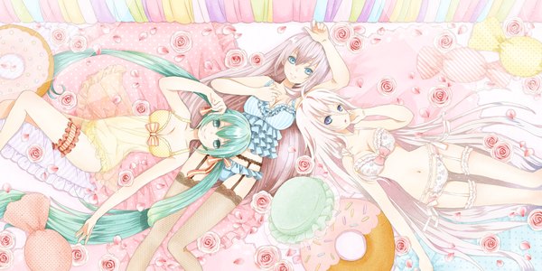 Anime picture 1600x800 with vocaloid hatsune miku megurine luka ia (vocaloid) mitsu0v0 long hair looking at viewer blush open mouth blue eyes light erotic smile wide image twintails bare shoulders pink hair cleavage lying very long hair aqua eyes