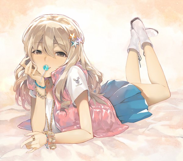 Anime picture 1087x960 with original dekappara futoriusu single long hair looking at viewer blonde hair holding brown eyes lying pleated skirt light smile legs mouth hold on stomach girl skirt hair ornament food bracelet sweets