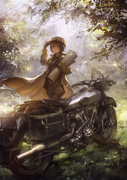 Anime picture 900x1273 with kino no tabi kino (kino no tabi) lm7 (op-center) single tall image looking at viewer fringe short hair smile brown hair standing holding green eyes wind sunlight hand on head sunbeam goggles on head girl gloves