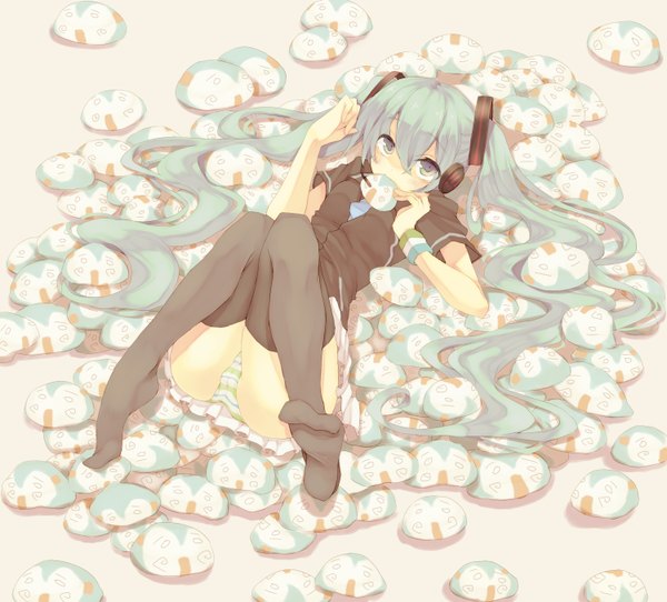 Anime picture 1500x1356 with vocaloid hatsune miku hiharu single long hair looking at viewer blush light erotic twintails holding lying pleated skirt barefoot green hair from above no shoes mouth hold soles multicolored eyes girl