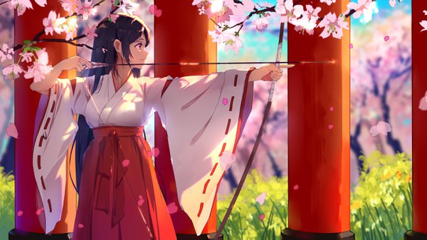 Anime picture 2500x1405 with original baisi shaonian single long hair highres black hair smile red eyes wide image standing looking away traditional clothes parted lips japanese clothes profile pleated skirt sunlight blurry wide sleeves cherry blossoms