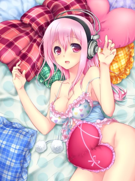 Anime picture 1000x1333 with nitroplus super sonico tall image looking at viewer blush breasts open mouth light erotic red eyes large breasts pink hair cleavage strap slip plaid girl bow heart headphones pillow pom pom (clothes)