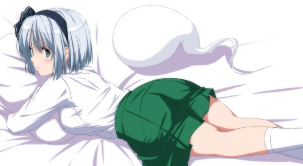 Anime picture 2656x1456 with touhou konpaku youmu myon nori tamago single looking at viewer blush highres short hair breasts wide image large breasts green eyes ass lying long sleeves parted lips pleated skirt grey hair on stomach