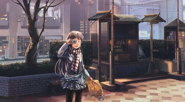 Anime picture 1000x555 with original suchfolder single long hair open mouth black hair wide image one eye closed wink girl skirt plant (plants) miniskirt tree (trees) scarf bag camera
