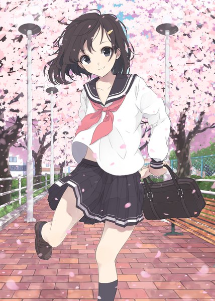 Anime picture 600x840 with original maruhana single tall image looking at viewer short hair smile brown hair standing holding ahoge bent knee (knees) outdoors long sleeves parted lips pleated skirt wind black eyes cherry blossoms happy