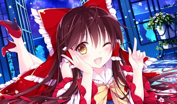Anime picture 1176x694 with touhou hakurei reimu mochizuki shiina long hair blush open mouth brown hair wide image yellow eyes traditional clothes japanese clothes one eye closed wink miko head rest girl dress flower (flowers) bow hair bow