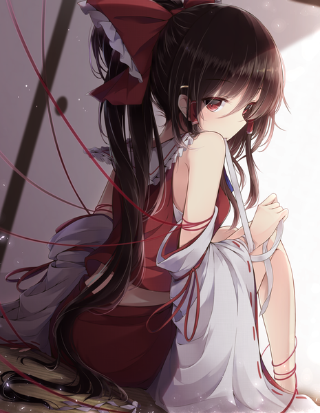 Anime picture 1180x1521 with touhou hakurei reimu toyosaki shu single long hair tall image looking at viewer fringe hair between eyes red eyes brown hair sitting bare shoulders holding bent knee (knees) ponytail traditional clothes japanese clothes looking back wide sleeves