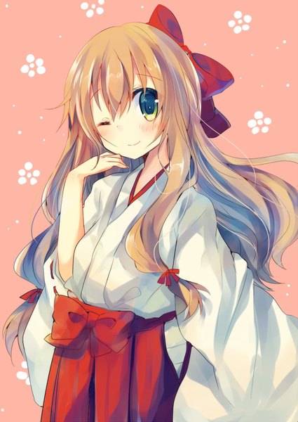 Anime picture 752x1062 with original asanagi kurumi (panda-doufu) single long hair tall image looking at viewer blush fringe blonde hair smile hair between eyes green eyes traditional clothes japanese clothes one eye closed wink pink background miko tress ribbon girl