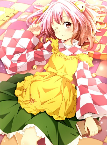 Anime picture 665x900 with touhou motoori kosuzu sui. (ayase) single tall image blush short hair pink hair lying one eye closed pink eyes wink loli two side up character names checkered floor floor clothes writing checkered hair bell