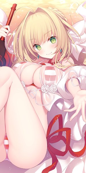 Anime picture 600x1200 with fate (series) fate/grand order nero claudius (fate) (all) nero claudius (swimsuit caster) (fate) miko (royal milk) single long hair tall image looking at viewer blush fringe breasts light erotic blonde hair hair between eyes large breasts bare shoulders holding green eyes payot