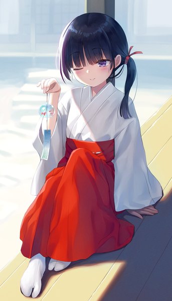 Anime picture 1280x2242 with original na-ga single long hair tall image black hair smile sitting purple eyes holding traditional clothes japanese clothes one eye closed shadow no shoes side ponytail miko girl socks white socks