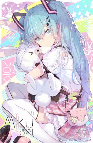 Anime picture 900x1380 with vocaloid hatsune miku rabbit yukine lf single long hair tall image looking at viewer blush fringe smile hair between eyes sitting twintails holding signed payot ahoge bent knee (knees) head tilt