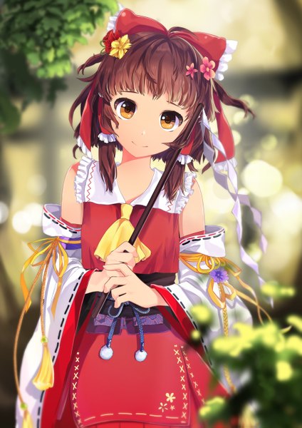 Anime picture 950x1343 with touhou hakurei reimu sera (kpj11) single tall image looking at viewer fringe short hair smile brown hair holding brown eyes traditional clothes hair flower girl hair ornament flower (flowers) ribbon (ribbons) bow hair bow