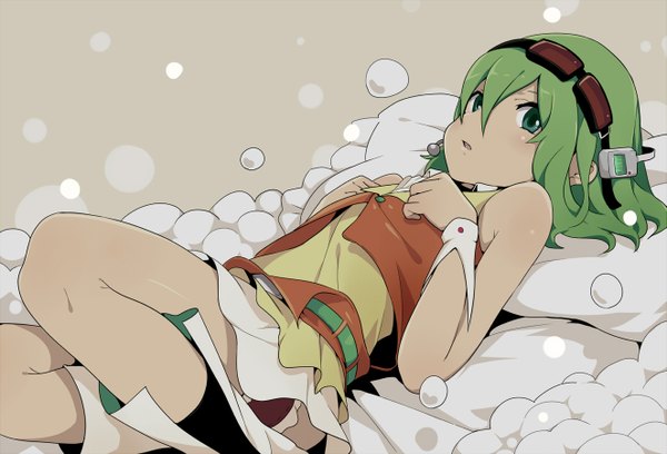 Anime picture 1323x900 with vocaloid gumi ogipote single short hair open mouth bare shoulders green eyes lying green hair girl miniskirt socks glasses belt headphones black socks wrist cuffs microphone goggles