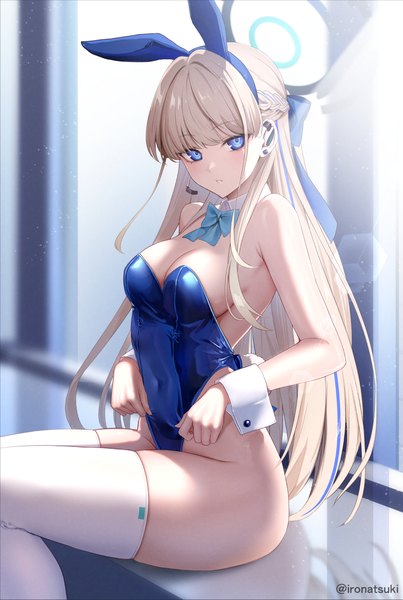 Anime picture 1073x1598 with blue archive toki (blue archive) toki (bunny) (blue archive) ironatsuki single long hair tall image looking at viewer blush fringe breasts blue eyes light erotic blonde hair large breasts sitting bare shoulders signed animal ears cleavage