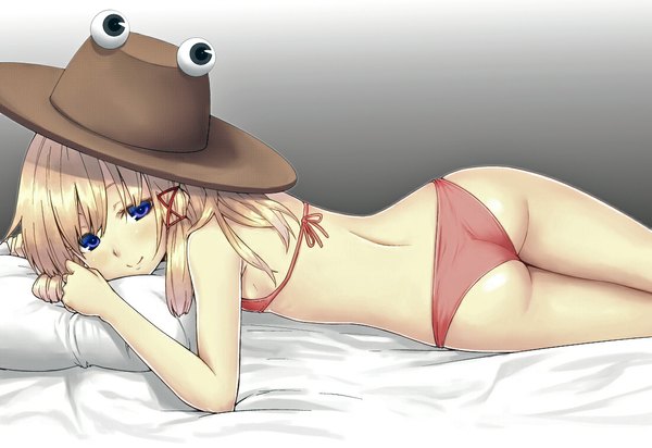 Anime picture 1100x756 with touhou moriya suwako blue eyes light erotic blonde hair simple background ass lying girl swimsuit hat pillow bed
