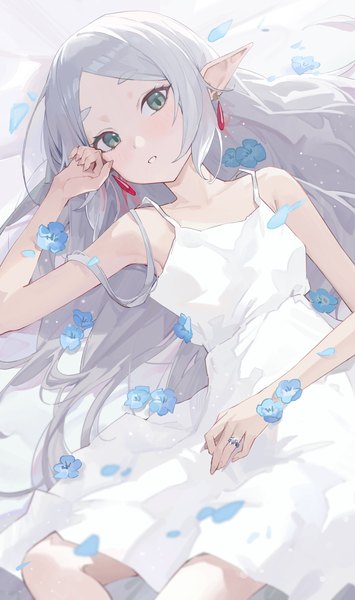 Anime picture 1200x2028 with sousou no frieren frieren shi classmate single long hair tall image looking at viewer green eyes silver hair lying pointy ears on back sleeveless elf girl dress flower (flowers) earrings petals white dress