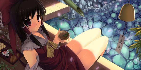 Anime picture 2500x1253 with touhou hakurei reimu caidychen single long hair highres black hair red eyes wide image legs girl bow hair bow detached sleeves water food cup stone (stones)