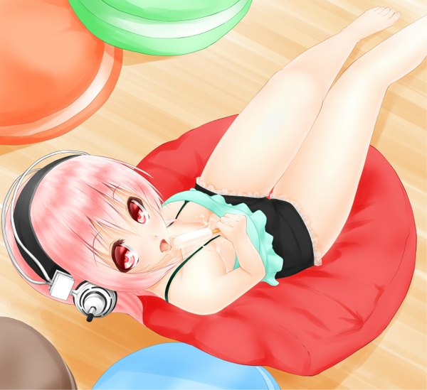 Anime picture 1304x1195 with nitroplus super sonico noppi (noppi 98) single long hair blush open mouth light erotic red eyes pink hair barefoot legs girl food shorts sweets tongue headphones short shorts ice cream
