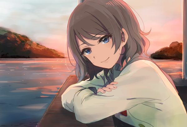 Anime picture 1400x951 with love live! sunshine!! sunrise (studio) love live! watanabe you monsieur single looking at viewer blush fringe short hair blue eyes brown hair sky upper body long sleeves head tilt light smile evening sunset crossed arms