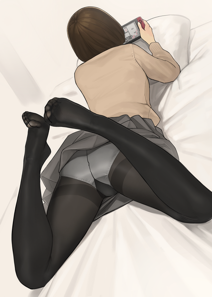 Anime picture 1072x1500 with original nintendo yomu (sgt epper) single tall image short hair light erotic simple background brown hair holding full body bent knee (knees) lying pleated skirt from above from behind no shoes legs on stomach playing games
