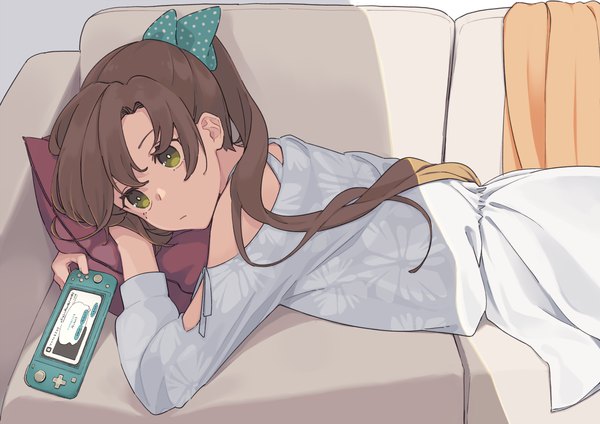 Anime picture 1500x1060 with kantai collection akigumo destroyer ichiroku (sakumogu-029) single long hair brown hair bare shoulders green eyes looking away ponytail lying on stomach girl dress bow hair bow couch game console