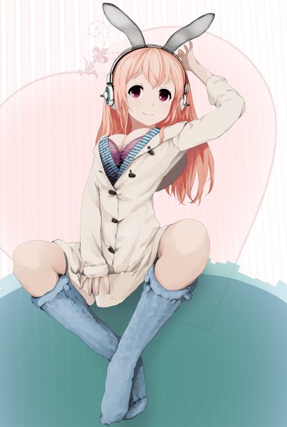 Anime picture 1000x1487 with nitroplus super sonico nishinogi long hair tall image looking at viewer breasts light erotic smile red eyes large breasts sitting animal ears pink hair bunny ears curvy girl thighhighs socks headphones