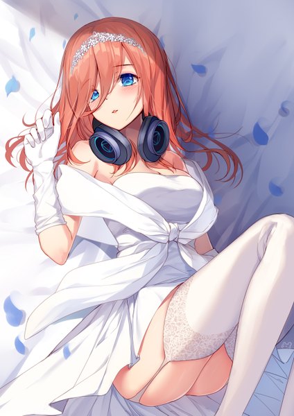 Anime picture 1000x1415 with go-toubun no hanayome nakano miku bison cangshu single long hair tall image looking at viewer blush fringe breasts blue eyes light erotic hair between eyes brown hair bare shoulders cleavage lying parted lips on back headphones around neck