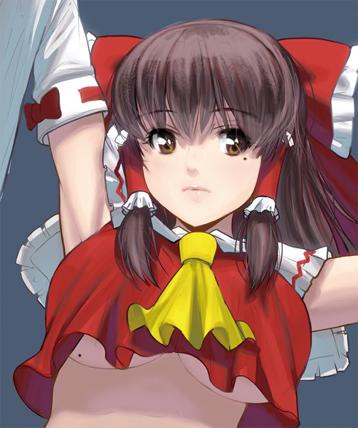 Anime picture 838x1000 with touhou hakurei reimu masao single long hair tall image looking at viewer breasts light erotic simple background brown hair large breasts brown eyes traditional clothes grey background mole no bra mole under eye miko mole on breast