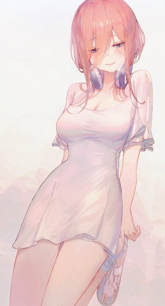 Anime picture 600x1108 with go-toubun no hanayome nakano miku seol single long hair tall image blush fringe breasts blue eyes simple background smile hair between eyes brown hair standing payot cleavage looking down standing on one leg headphones around neck