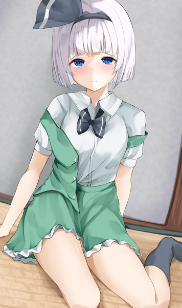 Anime picture 1077x1813 with touhou konpaku youmu 258n single tall image looking at viewer blush fringe short hair blue eyes sitting bent knee (knees) white hair indoors blunt bangs off shoulder arm support embarrassed no shoes frilly skirt