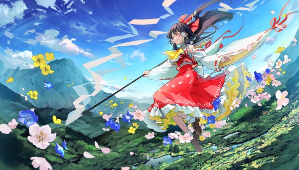 Anime picture 1500x853 with touhou hakurei reimu syuri22 single long hair blush black hair smile wide image holding sky cloud (clouds) outdoors traditional clothes japanese clothes wide sleeves mountain landscape frilly skirt nontraditional miko