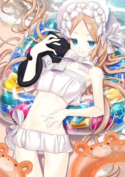 Anime picture 724x1024 with fate (series) fate/grand order abigail williams (fate) abigail williams (swimsuit foreigner) (fate) nyori single long hair tall image blue eyes light erotic blonde hair smile signed lying on back twitter username beach striped sand star print
