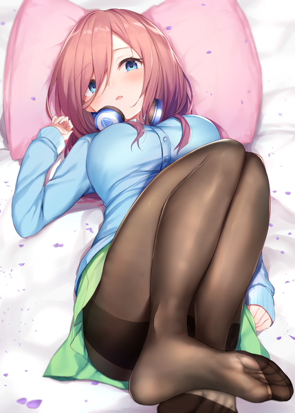 Anime picture 1036x1450 with go-toubun no hanayome nakano miku maosame single long hair tall image looking at viewer blush fringe breasts open mouth blue eyes light erotic hair between eyes brown hair bent knee (knees) lying on back no shoes headphones around neck