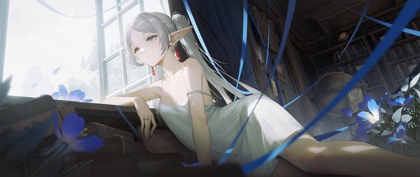 Anime picture 3072x1296 with sousou no frieren frieren dacheng ad single long hair fringe highres wide image twintails bare shoulders green eyes looking away silver hair indoors pointy ears strap slip elf reclining girl dress