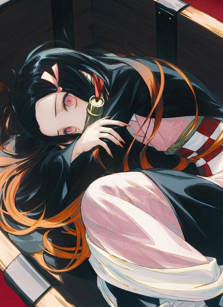 Anime picture 656x903 with kimetsu no yaiba ufotable kamado nezuko wanke single long hair tall image looking at viewer black hair holding bent knee (knees) lying traditional clothes japanese clothes pink eyes fingernails from above mouth hold on side gradient hair