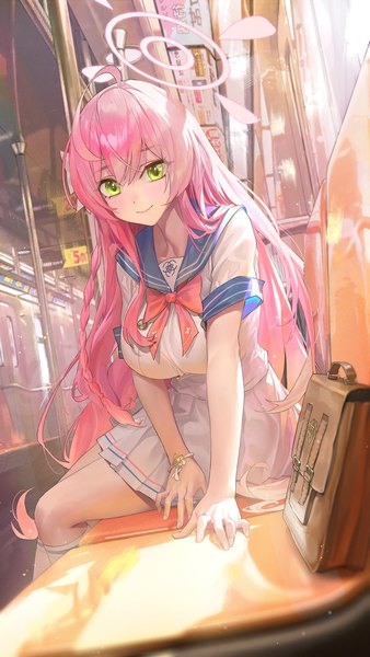 Anime picture 1499x2664 with blue archive mika (blue archive) ttk (kirinottk) single long hair tall image looking at viewer fringe breasts smile hair between eyes large breasts sitting green eyes pink hair indoors short sleeves train interior girl skirt