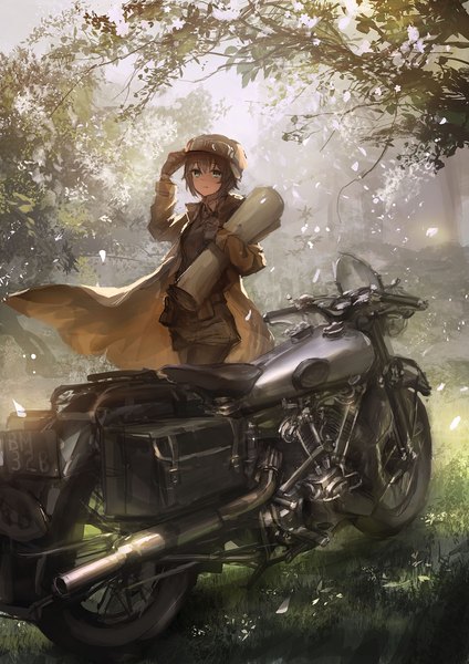 Anime picture 900x1273 with kino no tabi kino (kino no tabi) lm7 (op-center) single tall image looking at viewer short hair smile brown hair holding green eyes wind sunlight goggles on head girl gloves plant (plants) tree (trees) leaf (leaves) grass
