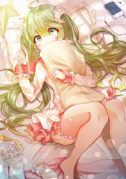 Anime picture 1200x1700 with vocaloid hatsune miku iop5509 single long hair tall image blush fringe hair between eyes twintails green eyes looking away ahoge indoors lying barefoot green hair on back knees together feet apart pillow hug