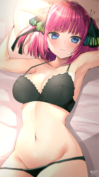Anime picture 1200x2135 with go-toubun no hanayome nakano nino akino ell single tall image looking at viewer blush fringe short hair breasts blue eyes light erotic large breasts signed pink hair cleavage lying blunt bangs arms up armpit (armpits)